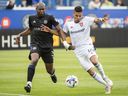 CF Montreal's Kamal Miller, left, challenges Real Salt Lake's Maikel Chang during second half MLS soccer action in Montreal, Sunday, May 22, 2022. CF Montreal defender Miller , is headed to the MLS All-Star game.  THE CANADIAN PRESS/Graham Hughes