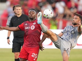 CF Montréal defender Rudy Camacho (4) attempts to control the ball as Toronto FC forward Ayo Akinola (20) defends during second half Voyageurs Cup semifinal soccer action against CF Montréal in Toronto on Wednesday, June 22, 2022. CF Montréal can achieve a lot - it needed to win and avenge an embarrassing loss at the hands of its arch-rival when the Major League Soccer club hosts Toronto FC on Saturday.
