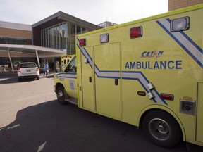 An ambulance drives up to a hospital on September 9, 2014 in Longueuill, Que.