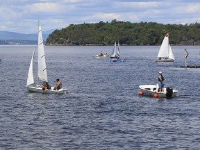 People pilot their boats in Burlington Harbor on Lake Champlain, in Burlington, Vt., Wednesday, June 23, 2021. In non-COVID-19 summers the harbor is filled with boats from Canada, while this summer locals are hoping the governments of the United States and Canada reopen the border to routine crossers so the boaters can return.