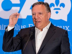 Quebec Premier Francois Legault answers questions in Repentigny, east of Montreal, on Tuesday, July 5, 2022.