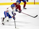 Canadiens prospect Joshua Roy, in red, checks on second-round pick Owen Beck during development camp at the Bell Sports Complex in Brossard last month.