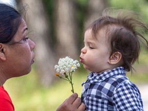 Nanny Shanny Ramos and 18-month-old Monty took time out to enjoy the flowers along the Lachine Canal in Montreal on Tuesday August 2, 2022.
