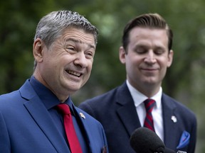 Scott Kilbride, left, the Canadian Party of Quebec's candidate in Verdun, addresses the media in Montreal on Tuesday, August 2, 2022 alongside party leader Colin Standish.
