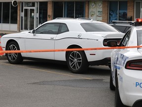 Montreal police secure a car believed to belong to homicide suspect Abdulla Shaikh, who was shot and killed by police at a St-Laurent motel on Thursday, August 4, 2022.