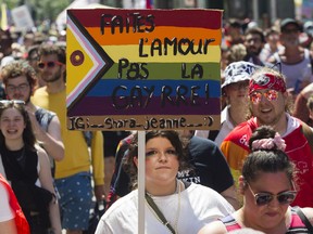 People march on Ste-Catherine St. in the Gay Village area of Montreal Sunday, August 7, 2022. This was during a protest march that was made after the Pride Parade was cancelled.