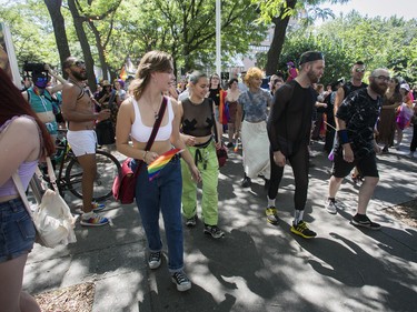 People do a square dance in Place Emilie-Gamelin in Montreal Sunday, Aug. 7, 2022. This was prior to a protest march that was made after the Pride Parade was cancelled.