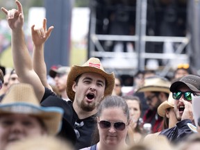 Fans cheer on JoJo Mason during the Lasso country music festival in Montreal on Friday, August 12, 2022.