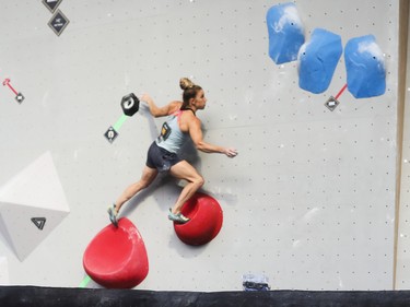 Petra Klinger prepares to make a move in the Bouldering competition at the Jackalope festival on the Esplanade of the Olympic Park in Montreal Sunday, August 21, 2022.