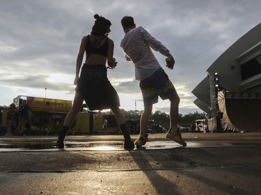 CJ Gettliffe-Simard and Frank Campbell dance at the Jackalope festival on the Esplanade of the Olympic Park in Montreal Sunday, August 21, 2022.