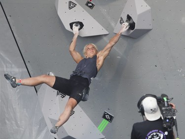 Babette Roy takes part in the Bouldering competition at the Jackalope festival on the Esplanade of the Olympic Park in Montreal Sunday, August 21, 2022.