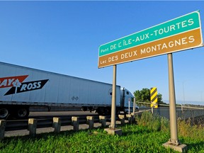 A truck crosses the westbound Île-aux-Tourtes Bridge into Vaudreuil-Dorion from Ste-Anne-de-Bellevue in 2013.