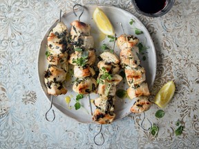 Lemon dressing is drizzled over chicken souvlaki, made with extra-virgin avocado or olive oil.