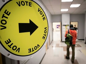 A voter arrives to cast a vote on de Bullion St., in the riding of Sainte-Marie–Saint-Jacques, for the Quebec provincial election in 2018.