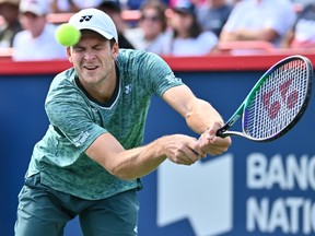 Poland's Hubert Hurkacz returns against Norway's Casper Ruud in the semifinals during day 8 of the National Bank Open at the Stade IGA on Saturday, August 13, 2022 in Montreal.