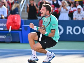 Pablo Carreno Busta of Spain celebrates his victory against Hubert Hurkacz of Poland in the final round at IGA Stadium in Montreal on Sunday.