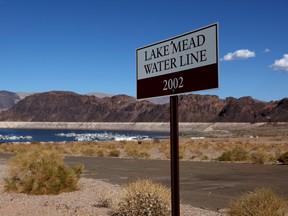 A sign showing where Lake Mead water levels were in 2002 is posted near the Lake Mead Marina on August 19, 2022 in Lake Mead National Recreation Area, Nevada.