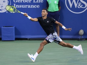 Félix Auger-Aliassime of Canada hits a return to Borna Coric of Croatia during the Western and Southern Open on Aug. 19, 2022, in Mason, Ohio.