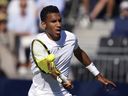 Canada's Felix Auger Aliassime during his ATP EXHO singles match against Novak Djokovic on day two of the Giorgio Armani Tennis Classic at the Hurlingham tennis club, England, Wednesday June 22, 2022.