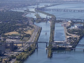 A ship navigates the St. Lawrence Seaway entrance toward the St. Lambert locks in this aerial view in Montreal in 2018.