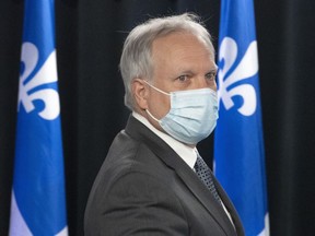 Quebec interim health director Dr. Luc Boileau arrives to give a COVID-19 update, Thursday, April 21, 2022 in Montreal. The Quebec health department is recommending the extension of the mask mandate until the middle of May.THE CANADIAN PRESS/Ryan Remiorz