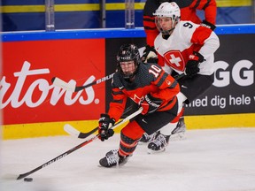Sarah Fillier of Canada, front, in action with Shannon Sigrist of Switzerland during The IIHF World Championship Woman’s ice hockey match between Canada and Switzerland in Herning, Denmark, Saturday, Aug. 27, 2022.