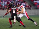 Montreal Alouettes wide-receiver Jake Wieneke after a catch as Ottawa Redblacks defensive-back Antoine Pruneau defends during first half in Ottawa on July 21, 2022.
