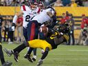 Alouettes' Mike Jones (8)'s devastating hit on Hamilton's Steven Dunbar in the fourth quarter two weeks ago forced a fumble and launched a Montreal comeback in the fourth quarter that fell short.