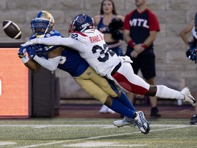 Alouettes cornerback Rodney Randle Jr. takes the ball out of the hands of Blue Bombers wide receiver Rasheed Bailey during the second quarter Thursday night at Molson Stadium.