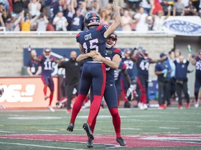 Montreal Alouettes kicker David Côté (15) is hoisted in the air by teammate Joseph Zema after scoring the winning field goal against the Hamilton Tiger-Cats during second half CFL football action in Montreal, Saturday, August 20, 2022.