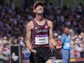 Evan Dunfee of Canada reacts after winning the men's 10,000 meters walk during the athletics in the Alexander Stadium at the Commonwealth Games in Birmingham, England, Sunday, Aug. 7, 2022. THE CANADIAN PRE$SS/AP/Manish Swarup