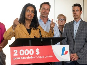 Quebec Liberal Leader Dominique Anglade speaks at a press conference surrounded by local candidates during a campaign on Aug. 30, 2022.