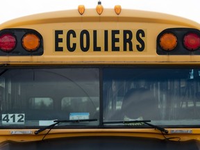 A Quebec school bus sits in a parking lot Monday August 10, 2020 in Gatineau, Que. THE CANADIAN PRESS/Adrian Wyld