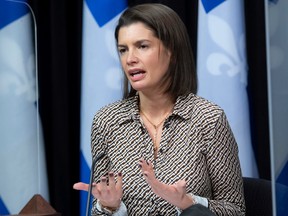 Quebec Deputy premier and Public Security Minister Genevieve Guilbault responds to reporters questions on Dec. 8, 2021 at the legislature in Quebec City.