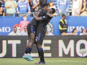 CF Montreal forward Romell Quioto, left, celebrates with teammate Victor Wanyama after scoring against Charlotte FC during first half MLS soccer action in Montreal, Saturday, June 25, 2022.