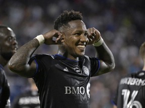 CF Montréal midfielder Romell Quioto (30) celebrates after scoring a goal against the New England Revolution during the first half at Stade Saputo in Montreal on Saturday, Aug. 20, 2022.