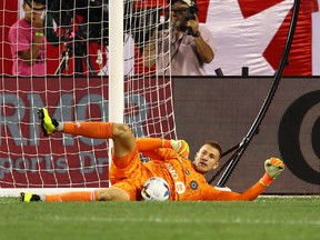 CF Montreal goalkeeper Sebastian Breza makes a save against the Chicago Fire during the second half at Soldier Field on Aug. 27, 2022.
