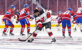 New Jersey Devils defenceman P.K. Subban passes the puck while warming up prior to a game against the Montreal Canadiens at the Bell Centre on Feb. 8, 2022