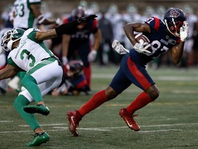 Montreal Alouettes receiver Eugene Lewis shakes off Saskatchewan Roughriders defensive-back Nick Marshall in Montreal on June 23, 2022.
