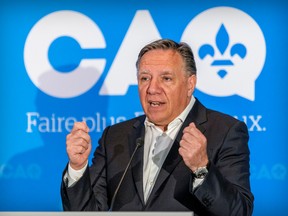 Coalition Avenir Québec leader François Legault appears at a candidate announcement in July. "Legault is ill-placed to talk about social cohesion after having divided Quebecers on many issues. While I acknowledge that as things stand today, Legault and the CAQ are on their way to securing a second mandate, I would be foolish to disregard what has been done under the first one," Fariha Naqvi-Mohamed writes.