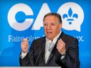 Coalition Avenir Québec leader François Legault appears at a candidate announcement in July. 