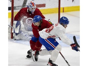 Vinzenz Rohrer, left, clears Filip Mesar during the Montreal Canadiens' evaluation camp at the Bell Sports Complex in Brossard, on July 11, 2022.