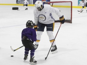 P.K. Subban gives pointers to young kids, during his hockey clinic in Pierrefonds on Aug. 25, 2018.