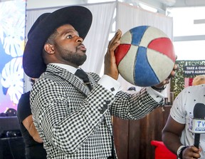 P.K. Subban shoot hoops on an arcade basketball game while doing media interviews before his fundraising dinner for his charitable foundation in Montreal on Aug. 30, 2018.