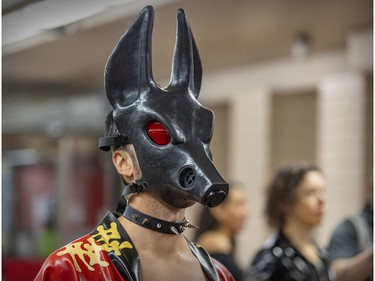 A Fetish Weekend participant wears a dog mask in the St-Laurent métro station during a fetish photo walk in downtown Montreal on Sunday, Sept. 4, 2022.