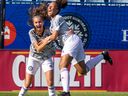 The grey team's Amy Medley, right, celebrates her first half goal with teammate Olivia Miranda during the Women's All-Star Game featuring U-13 and U-14 players at Saputo Stadium in Montreal on Sunday, Sept. 4, 2022.