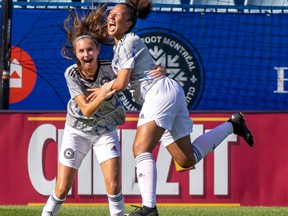 The grey team's Amy Medley, right, celebrates her first half goal with teammate Olivia Miranda during the Women's All-Star Game featuring U-13 and U-14 players at Saputo Stadium in Montreal on Sunday, Sept. 4, 2022.