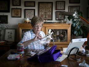 Dina Iwanycky stitches a floral embroidery design at home. She is part of the Lakeshore Creative Stitchery Guild, whose members gather weekly to share their passion for needlework and embroidery art, to stitch together and to learn from one another.