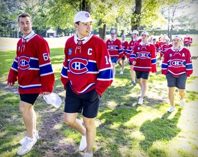 Nick Suzuki leads his team-mates after being named their new captain at the annual Montreal Canadiens golf tournament in Laval on Sept. 12, 2022.