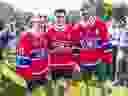 Nick Suzuki stops for a picture after being named the new captain of the Montreal Canadiens with assistant captains Brendan Gallagher, left, and Joel Edmundson at the team's annual golf tournament in Laval on Sept. 12, 2022.